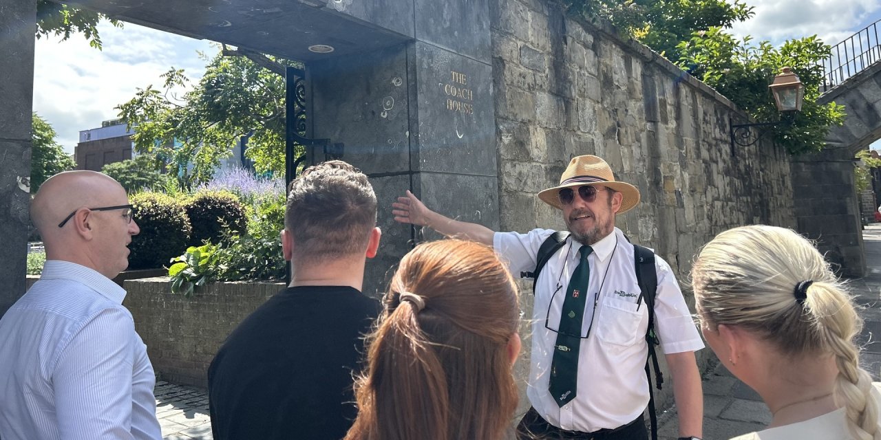 man pointing at wall 